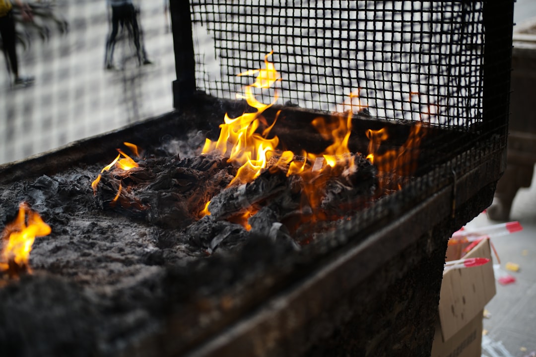 Flames burning on a charcoal grill