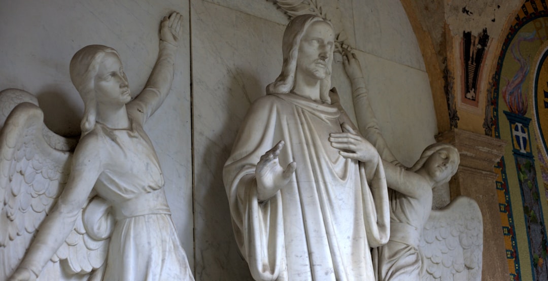 Marble sculpture of jesus with two angels