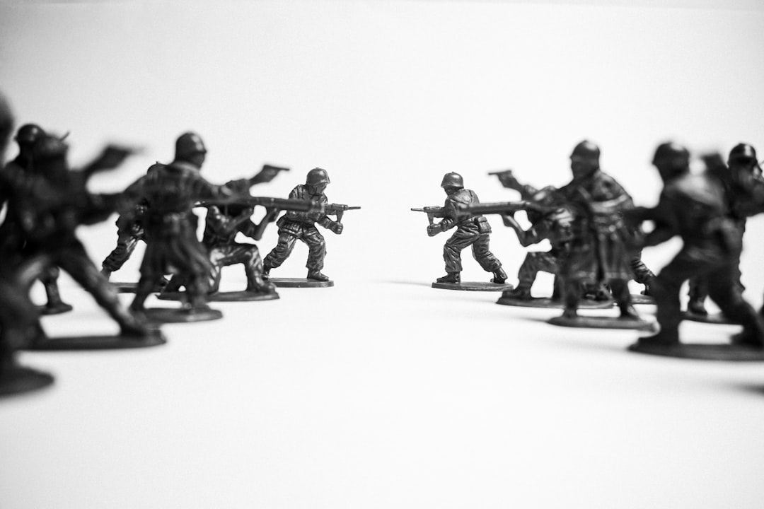 Toy soldiers facing each other on a white background