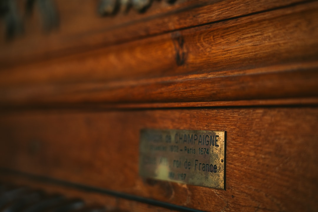 a close up of a wooden piano with a plaque on it